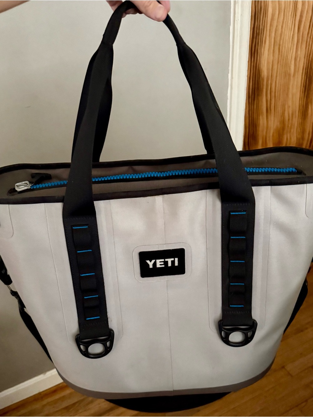 Yeti Hopper 30 in Light Gray with Black Straps and Blue Zipper Accents